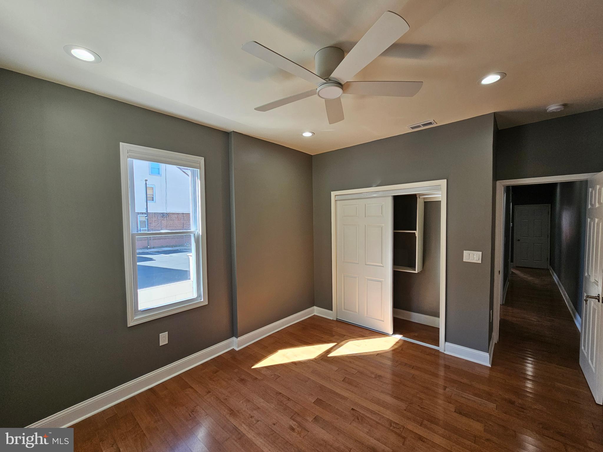 835 East State Street, Unit 1 Trenton, NJ 08609 - Photo 8 of 10 a view of an empty room with window and wooden floor