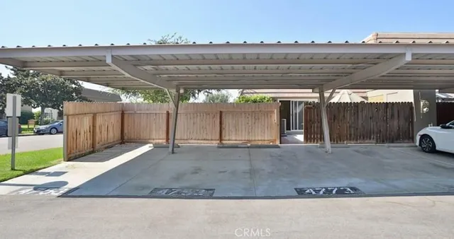 a view of a big yard with table and chairs