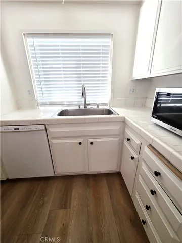 a kitchen with a sink and a window