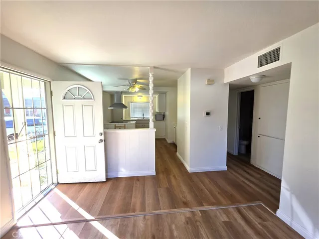 a view of a kitchen from the hallway