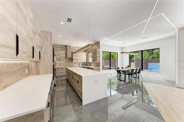 a view of a dining room with furniture and window