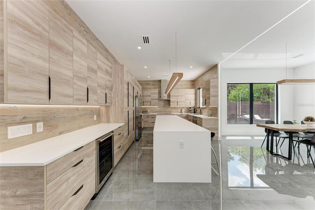 1716 9th Street Sarasota, FL 34236 - Photo 14 of 88 a living room with stainless steel appliances kitchen island granite countertop a sink and cabinets