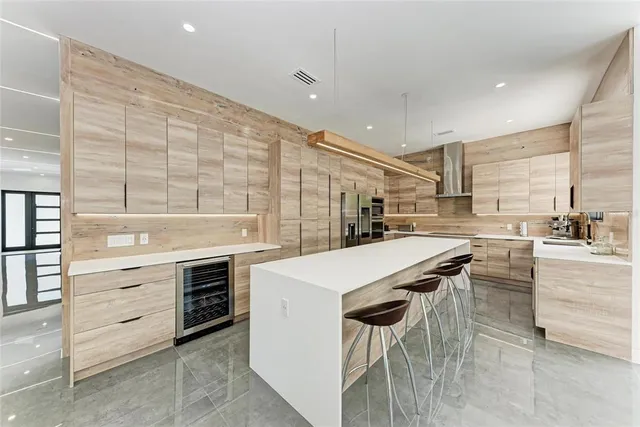 a spacious bedroom with a bed and large window