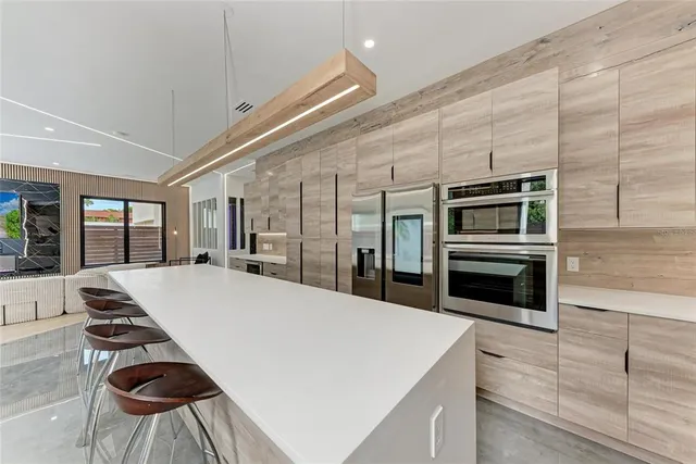 a bedroom with a large bed and a large window