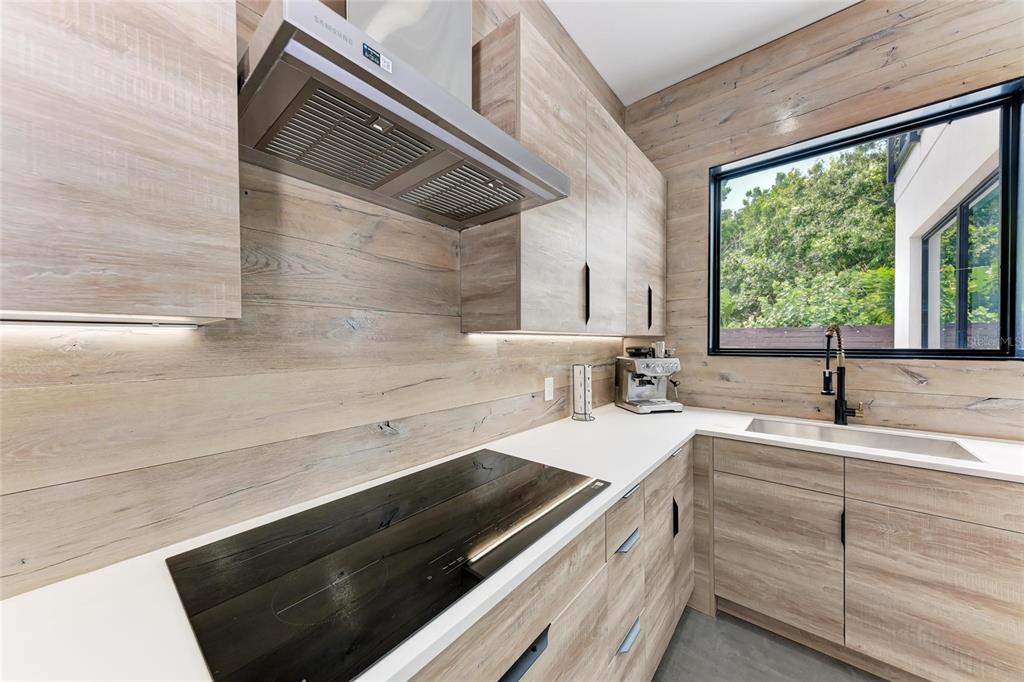 1716 9th Street Sarasota, FL 34236 - Photo 18 of 88 a kitchen with a sink and a window