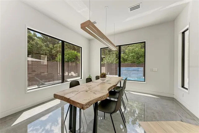a white refrigerator freezer and a stove sitting inside of a kitchen
