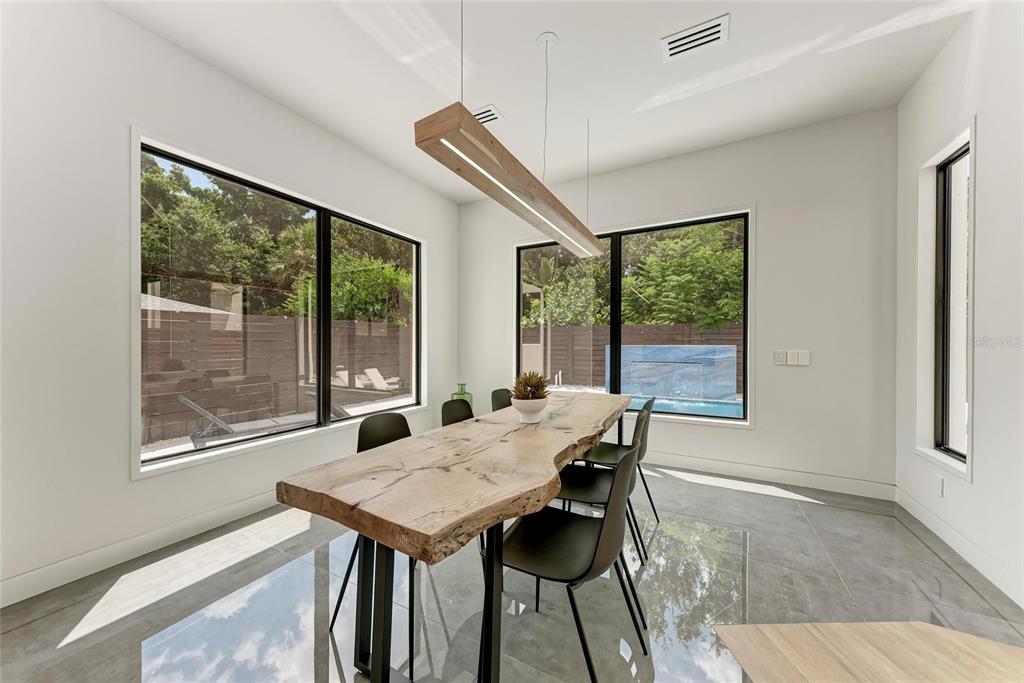 1716 9th Street Sarasota, FL 34236 - Photo 19 of 88 a view of a dining room with furniture window and outside view