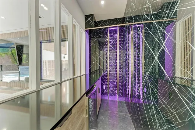 a view of hallway with stairs and wooden floor