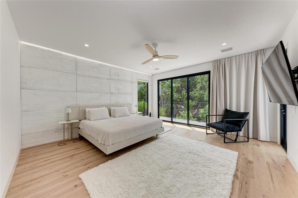 1716 9th Street Sarasota, FL 34236 - Photo 24 of 88 a spacious bedroom with a bed and large window