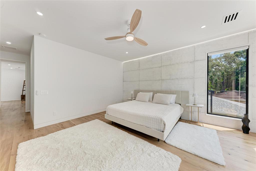 1716 9th Street Sarasota, FL 34236 - Photo 27 of 88 a bedroom with a large bed and a large window