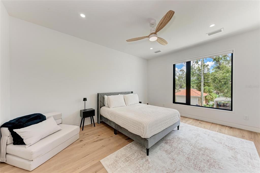 1716 9th Street Sarasota, FL 34236 - Photo 38 of 88 a spacious bedroom with a bed and a large window