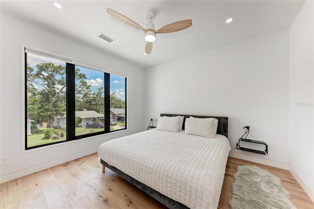 1716 9th Street Sarasota, FL 34236 - Photo 42 of 88 a bedroom with a large bed and a large window