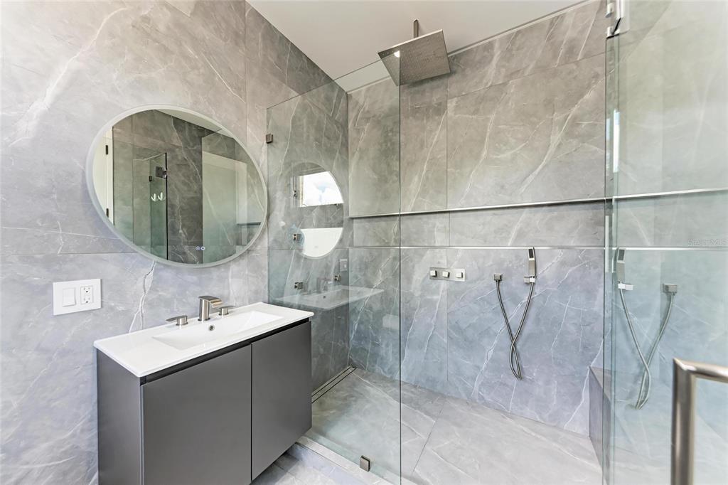 1716 9th Street Sarasota, FL 34236 - Photo 45 of 88 a bathroom with a sink and a mirror