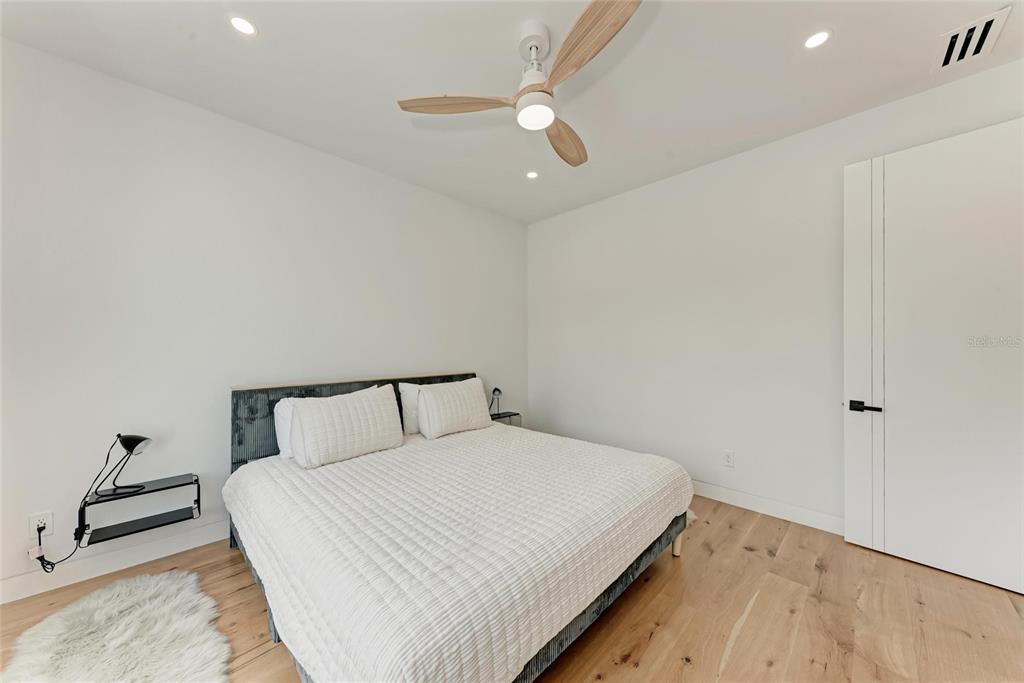1716 9th Street Sarasota, FL 34236 - Photo 47 of 88 a bedroom with a bed and a ceiling fan