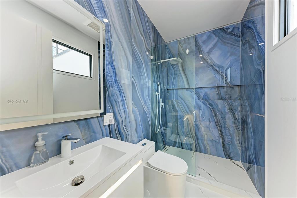 1716 9th Street Sarasota, FL 34236 - Photo 48 of 88 a bathroom with a sink toilet and shower