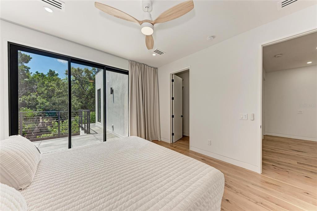 1716 9th Street Sarasota, FL 34236 - Photo 52 of 88 a bedroom with a large bed and a large window