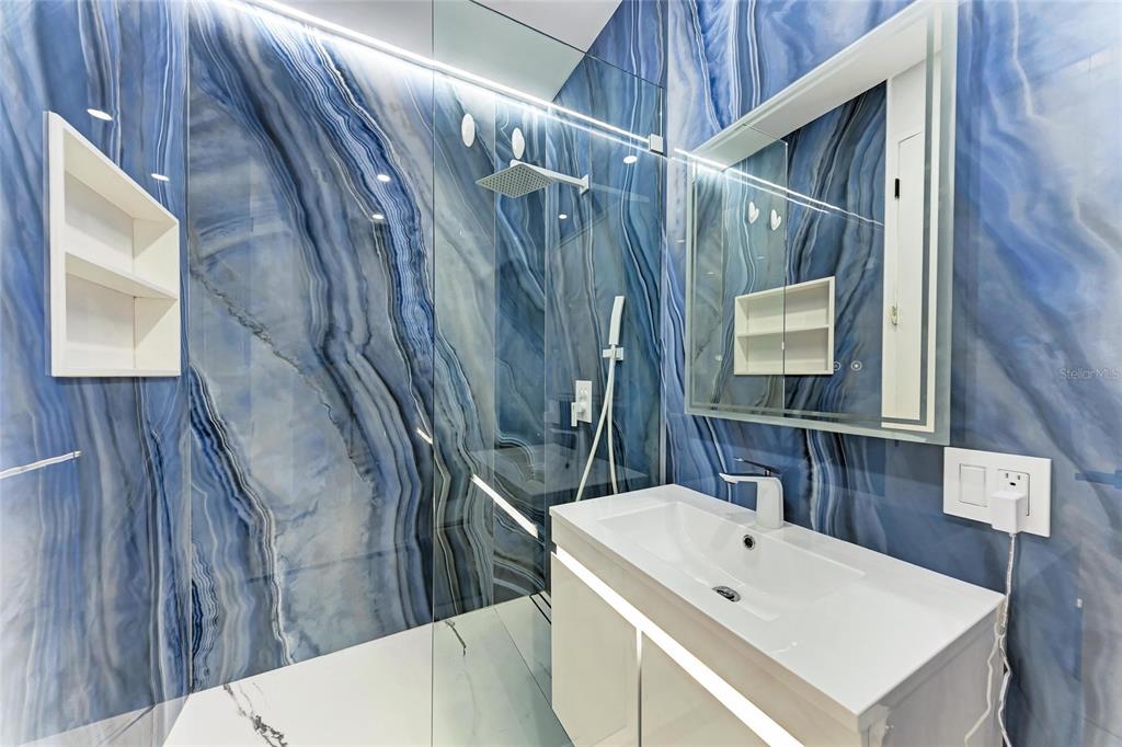 1716 9th Street Sarasota, FL 34236 - Photo 54 of 88 a bathroom with a sink a mirror and a toilet