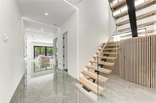 a bedroom with a large bed and a large window