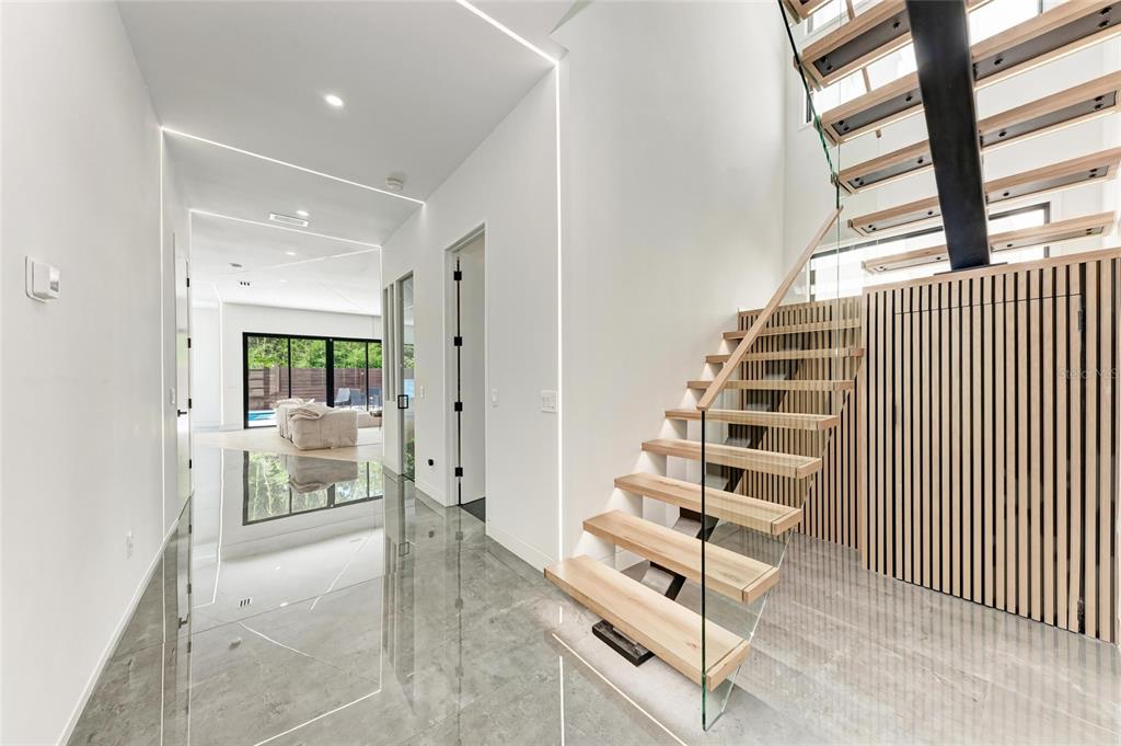 1716 9th Street Sarasota, FL 34236 - Photo 6 of 88 a view of an entryway with wooden floor and windows