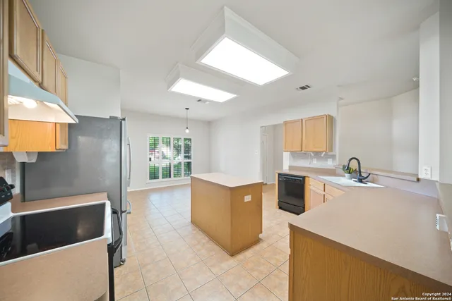 a kitchen with a cabinets and appliances