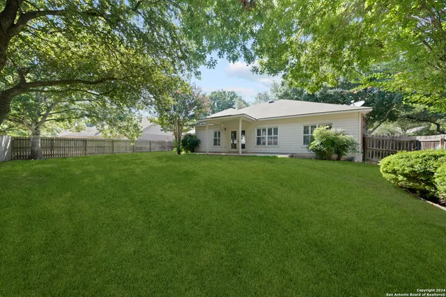 a view of a house with a big yard