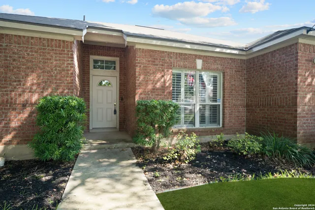 a view of a house with a garden