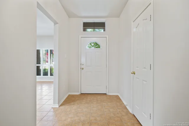 a view of an entryway with wooden floor