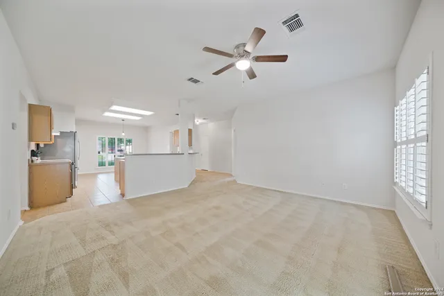 a view of a kitchen with a sink and a window