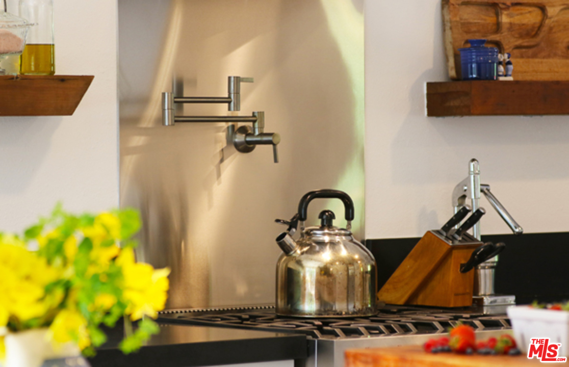 1580 Las Virgenes Road Calabasas, CA 91302 - Photo 12 of 51 a close view of a sink a faucet and a stove