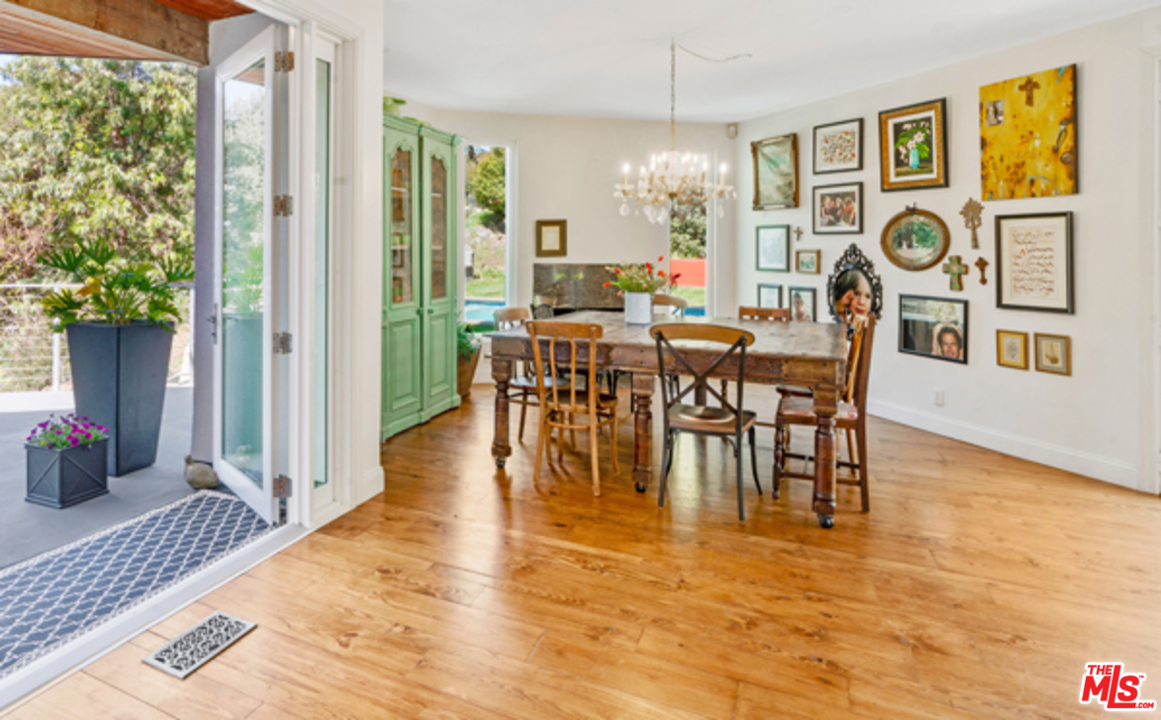 1580 Las Virgenes Road Calabasas, CA 91302 - Photo 13 of 51 a view of a dining room with furniture window and wooden floor