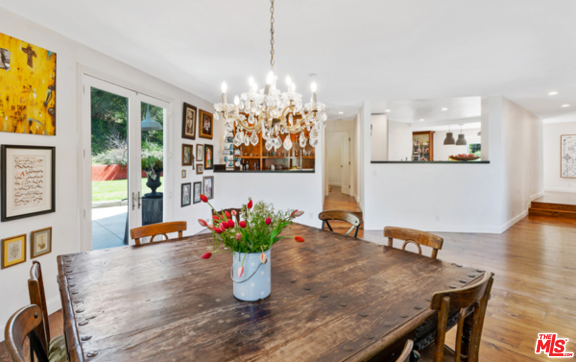1580 Las Virgenes Road Calabasas, CA 91302 - Photo 15 of 51 a dining room with furniture and wooden floor