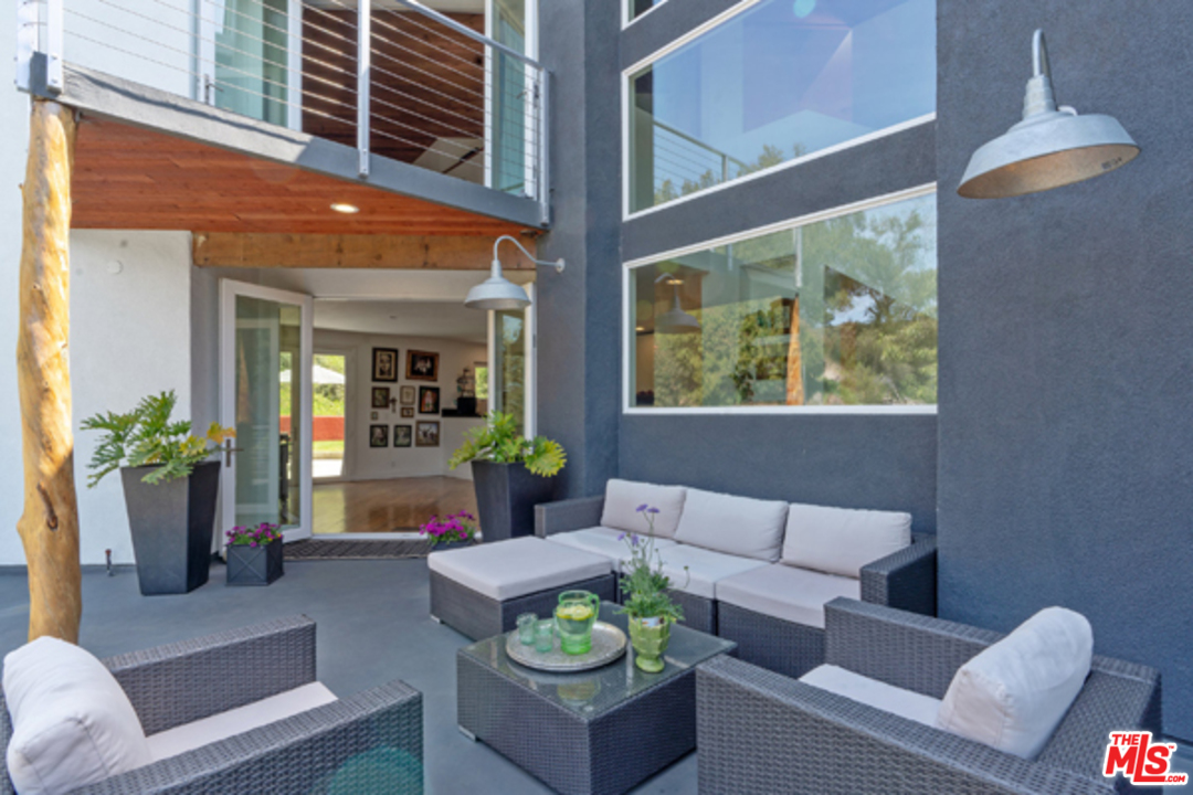 1580 Las Virgenes Road Calabasas, CA 91302 - Photo 17 of 51 a living room with furniture and a potted plant