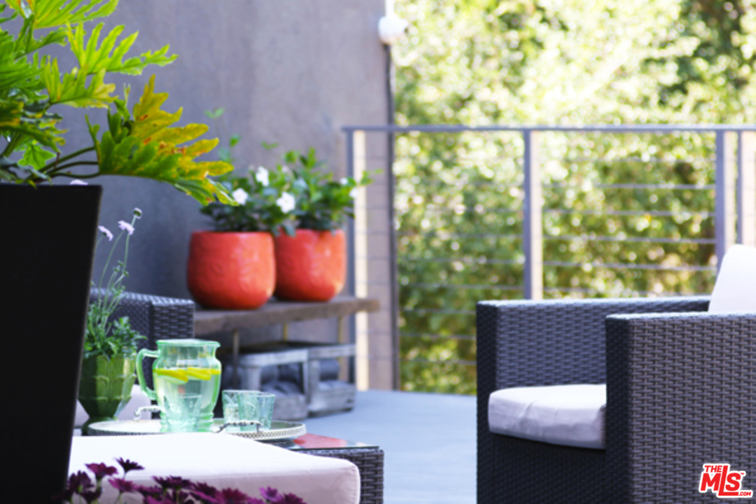 1580 Las Virgenes Road Calabasas, CA 91302 - Photo 18 of 51 a bedroom with furniture and a potted plant