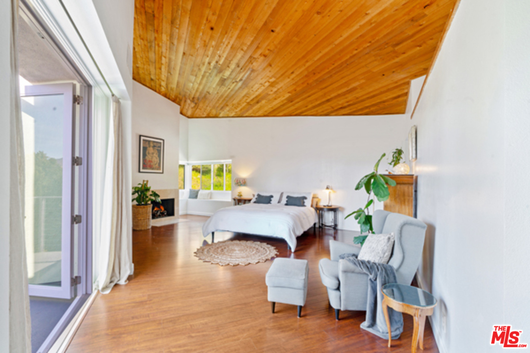 1580 Las Virgenes Road Calabasas, CA 91302 - Photo 19 of 51 a living room with furniture and a table