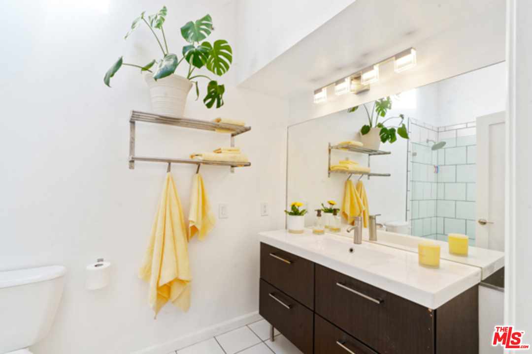1580 Las Virgenes Road Calabasas, CA 91302 - Photo 27 of 51 a bathroom with a sink and a mirror