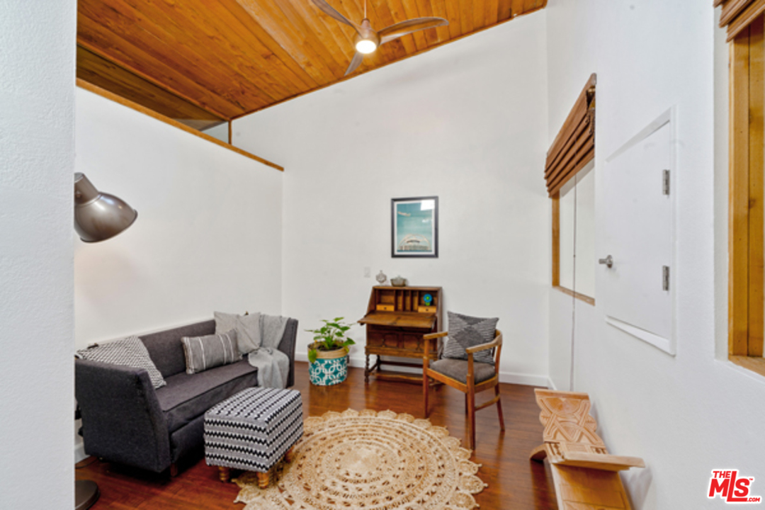1580 Las Virgenes Road Calabasas, CA 91302 - Photo 29 of 51 a living room with furniture and a rug