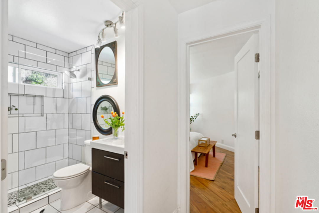 1580 Las Virgenes Road Calabasas, CA 91302 - Photo 30 of 51 a bathroom with a toilet and a shower