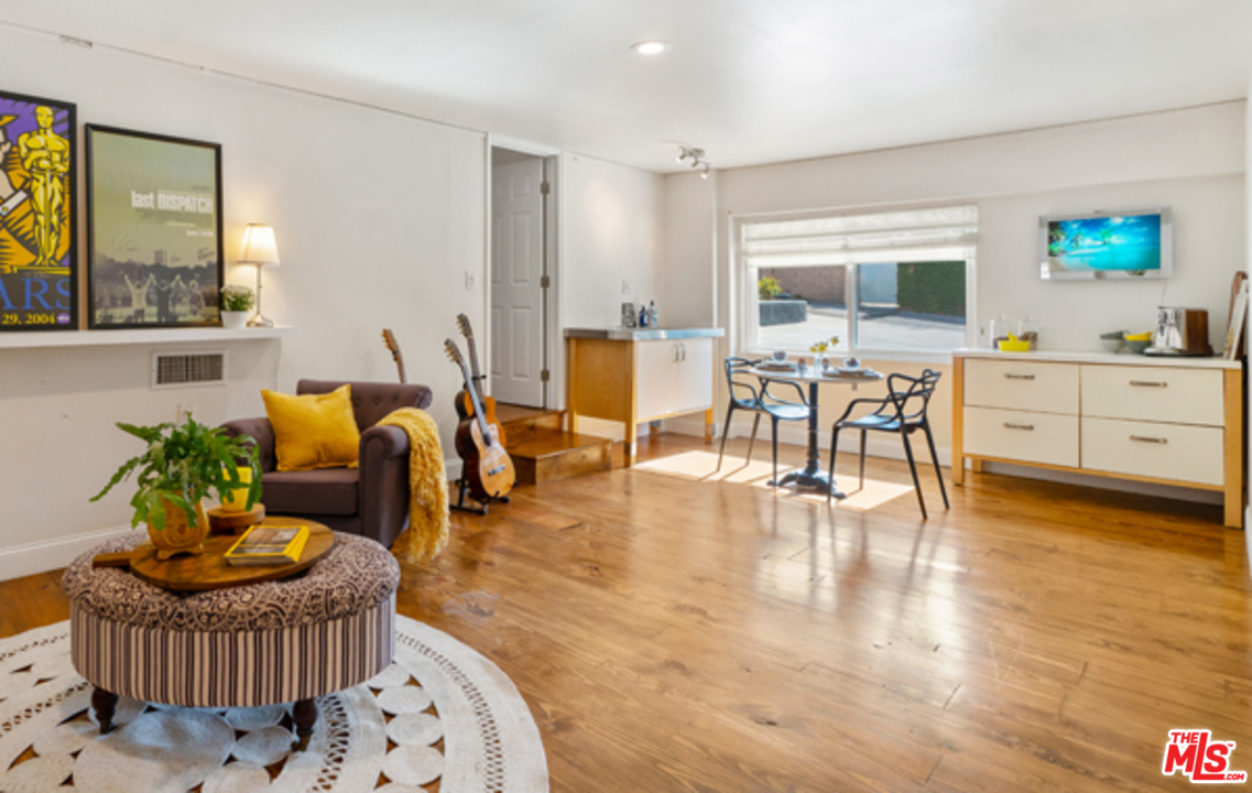 1580 Las Virgenes Road Calabasas, CA 91302 - Photo 32 of 51 a living room with furniture and wooden floor
