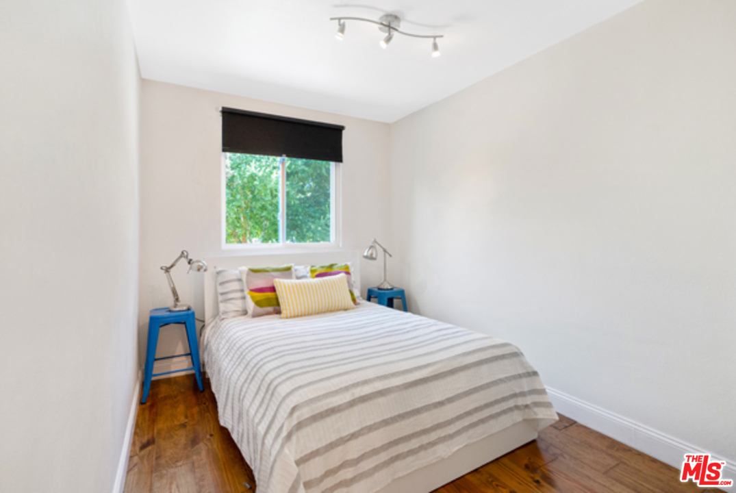 1580 Las Virgenes Road Calabasas, CA 91302 - Photo 37 of 51 a bedroom with a bed and a window