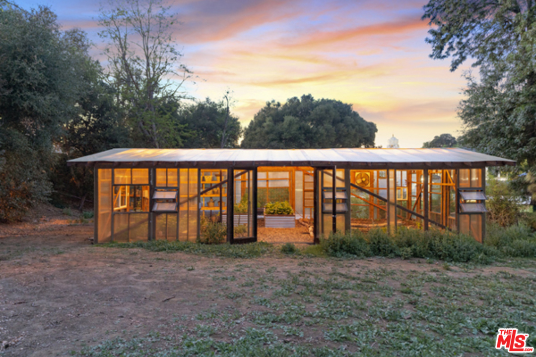 1580 Las Virgenes Road Calabasas, CA 91302 - Photo 40 of 51 a view of a house with backyard and trees