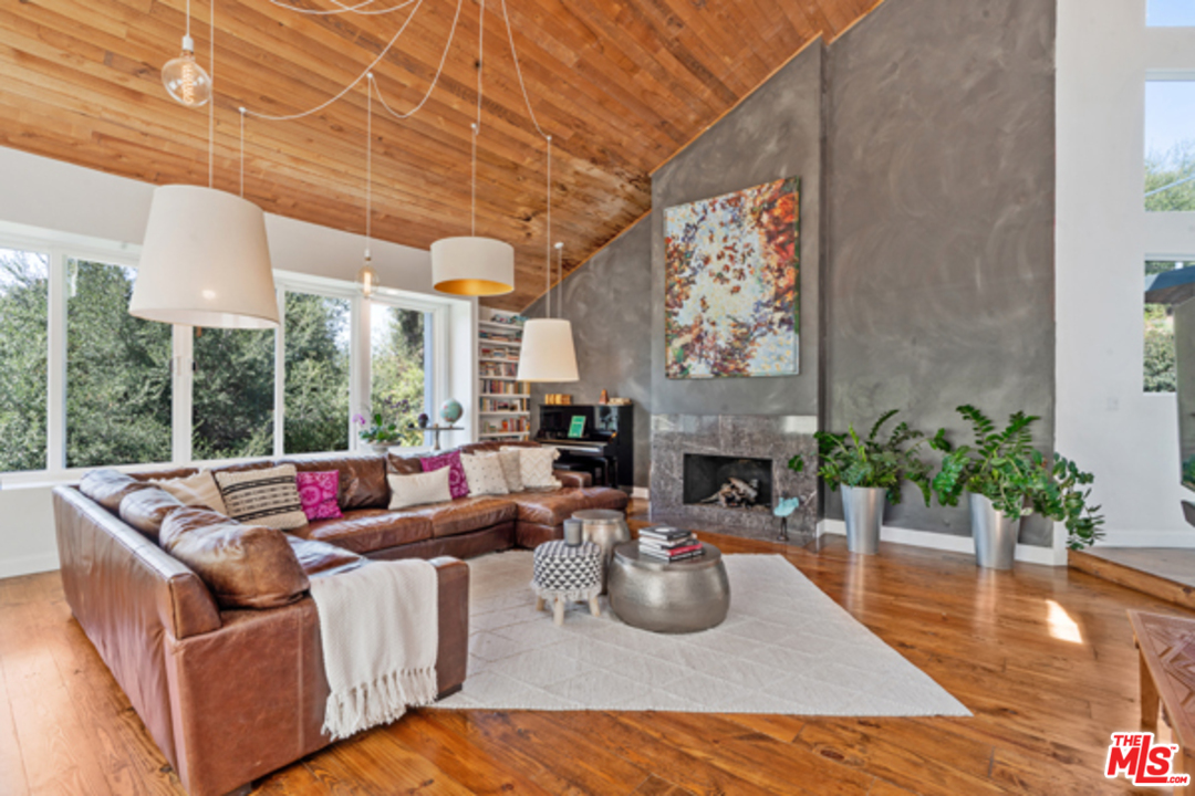 1580 Las Virgenes Road Calabasas, CA 91302 - Photo 5 of 51 a living room with fireplace furniture and a large window