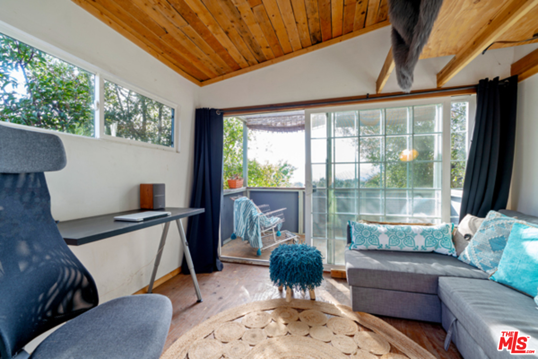 1580 Las Virgenes Road Calabasas, CA 91302 - Photo 50 of 51 a living room with furniture and a large window
