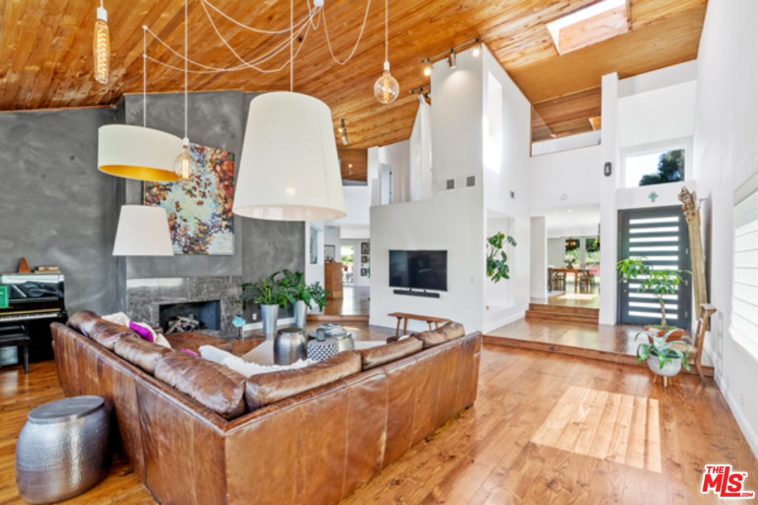 1580 Las Virgenes Road Calabasas, CA 91302 - Photo 7 of 51 a living room with fireplace furniture and a fireplace