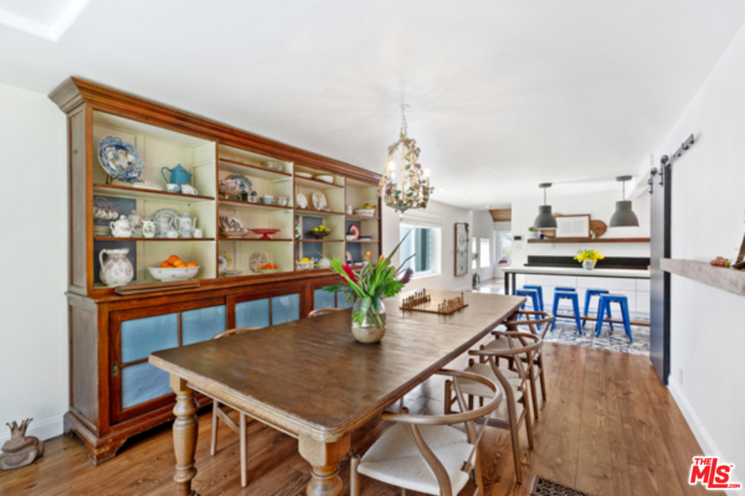 1580 Las Virgenes Road Calabasas, CA 91302 - Photo 9 of 51 a view of a dining room with furniture and a potted plant