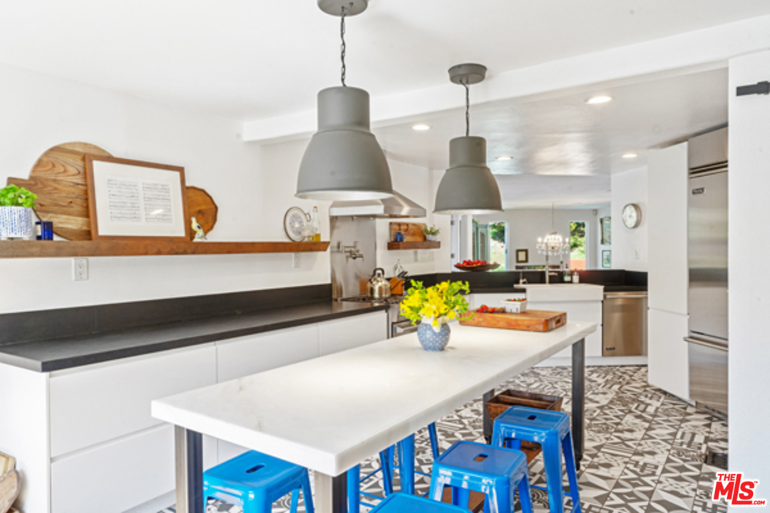1580 Las Virgenes Road Calabasas, CA 91302 - Photo 10 of 51 a living room with furniture and kitchen view