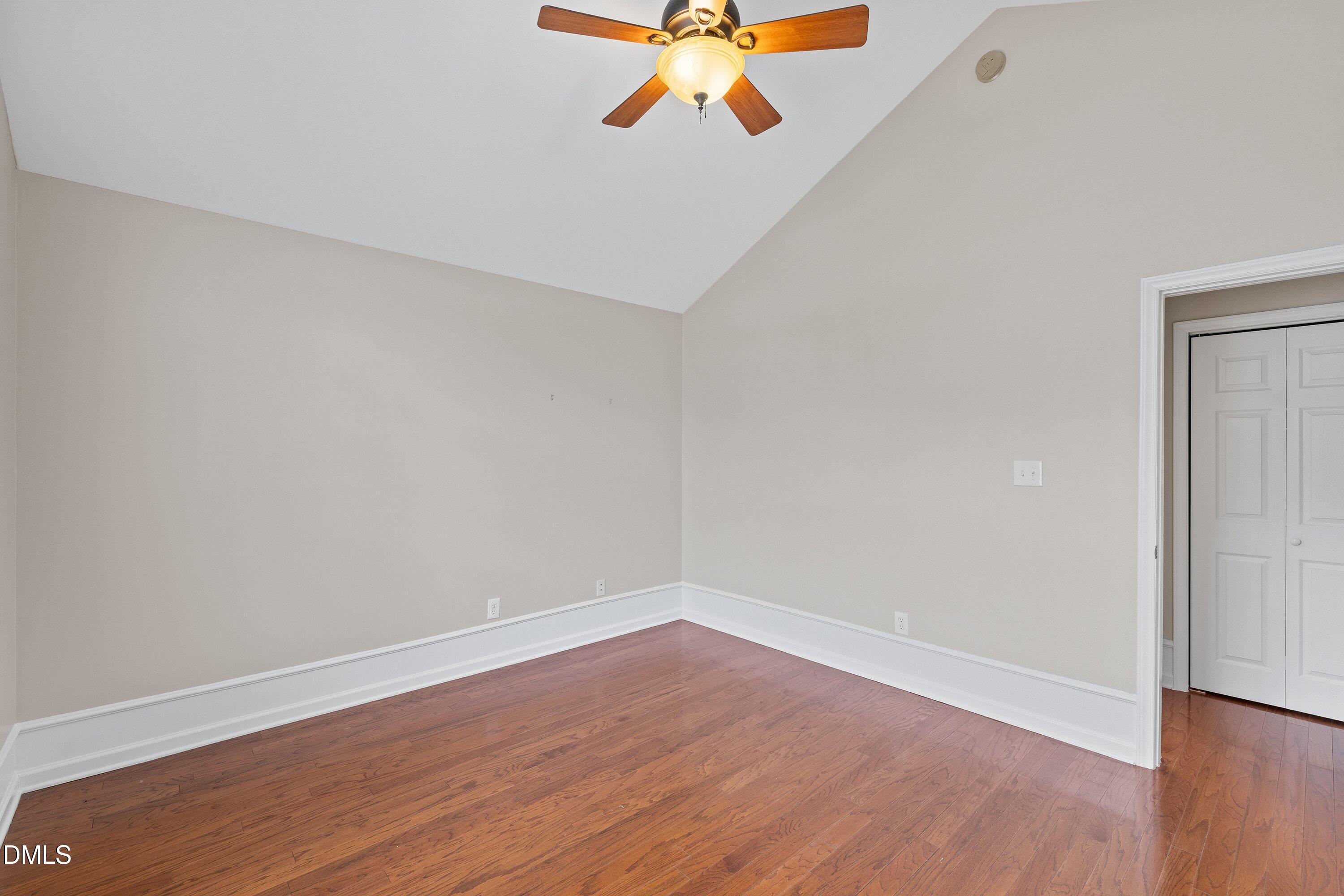 3666 East Cotton Gin Drive Clayton, NC 27527 - Photo 28 of 33 a view of an empty room with wooden floor