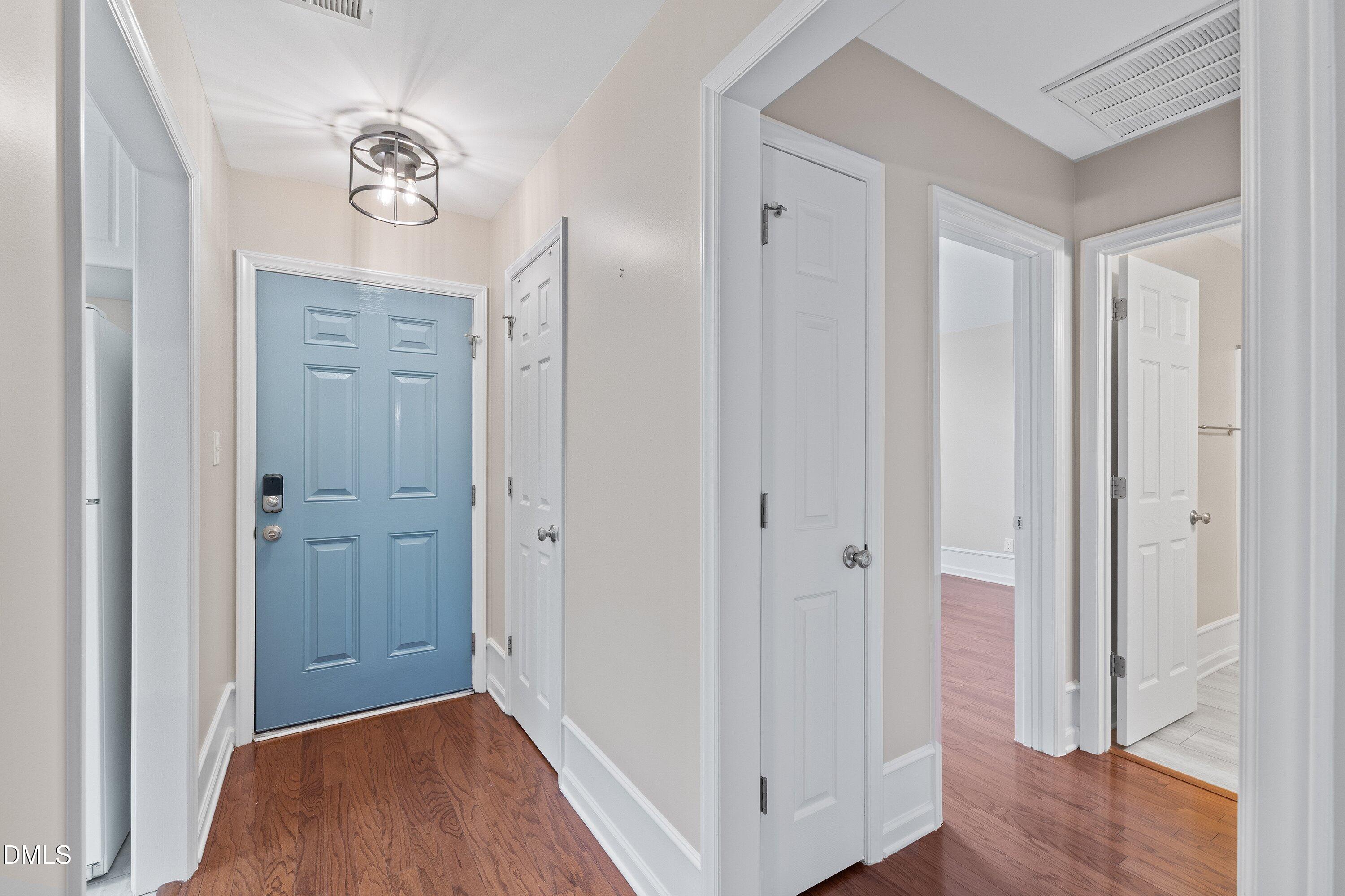3666 East Cotton Gin Drive Clayton, NC 27527 - Photo 6 of 33 a view of a hallway with wooden floor