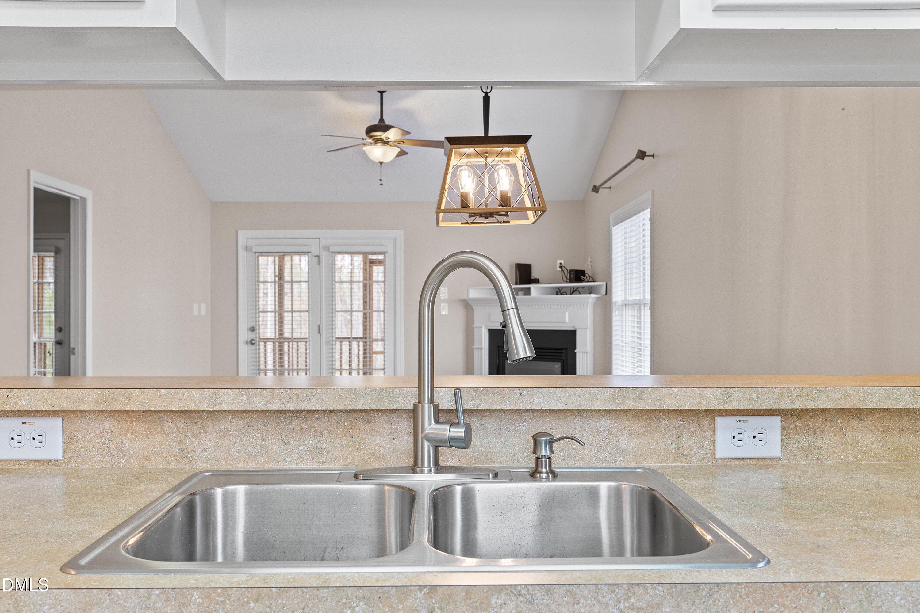 3666 East Cotton Gin Drive Clayton, NC 27527 - Photo 10 of 33 a close view of a sink and a kitchen counter space