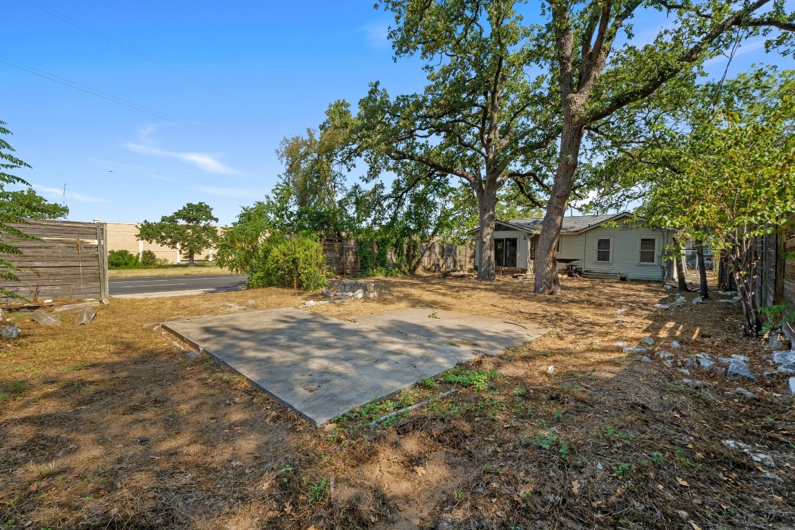 1811 Palma Plaza Austin, TX 78703 - Photo 15 of 17 a backyard of a house with large trees and outdoor space