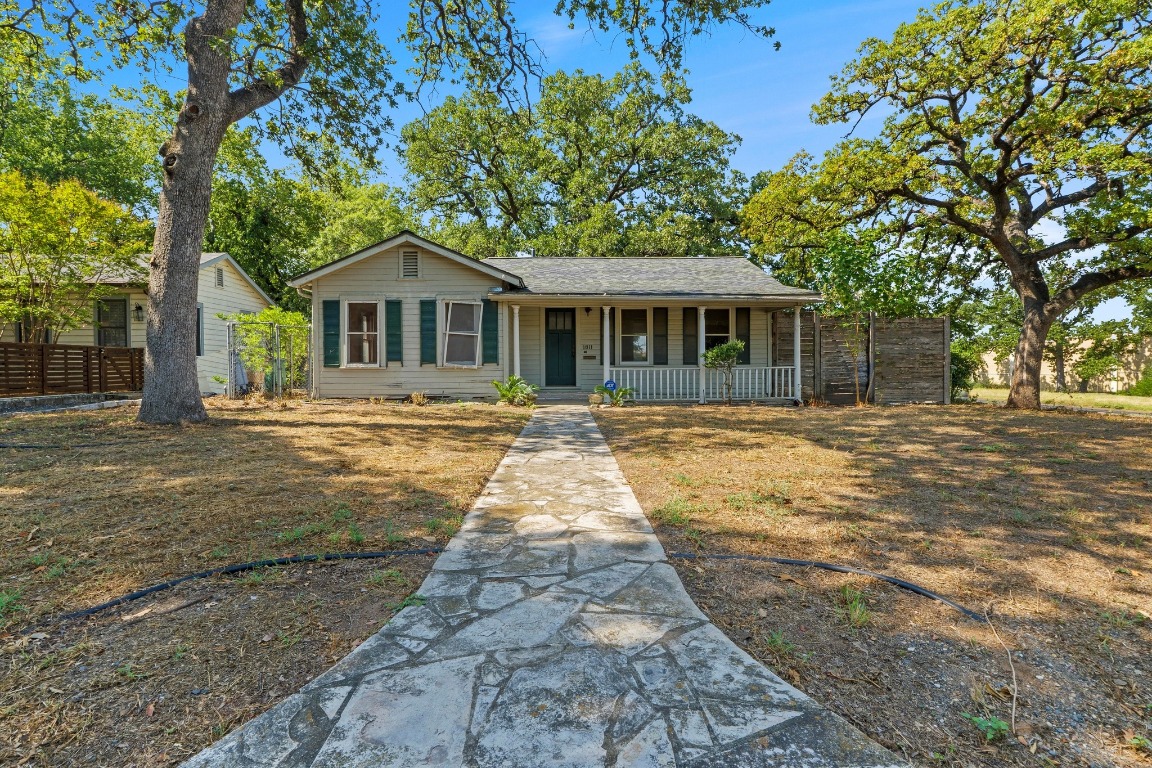 1811 Palma Plaza Austin, TX 78703 - Photo 2 of 17 a front view of a house with a garden
